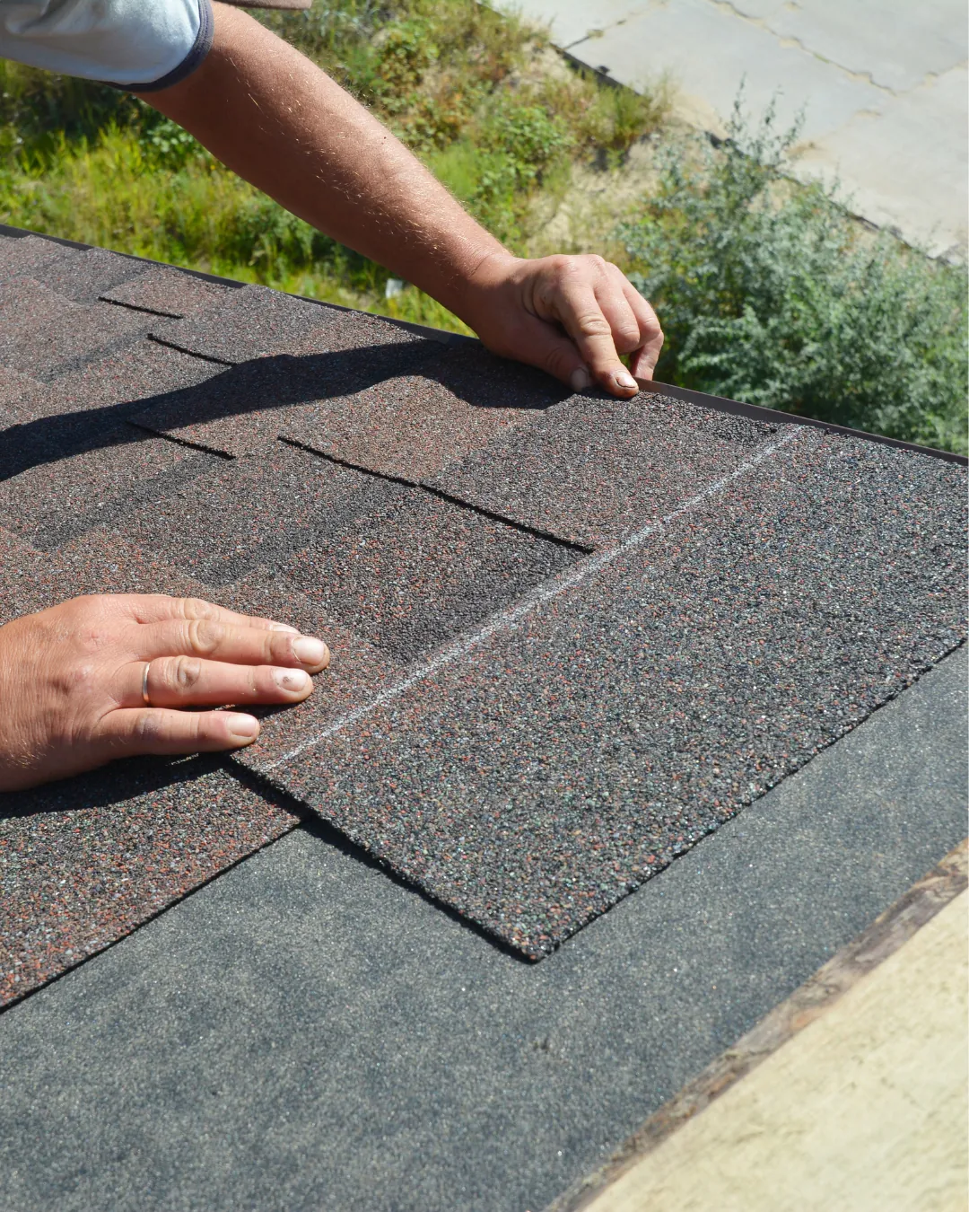 Close up of roofing shingles being installed