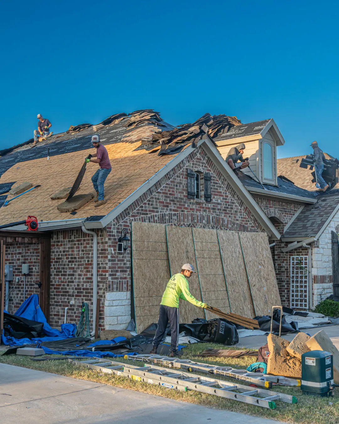 Roofing crew working on a residential roof